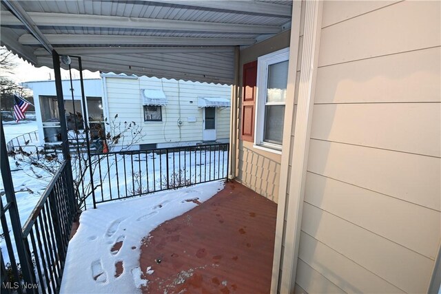 view of snow covered deck