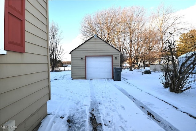 view of snow covered garage