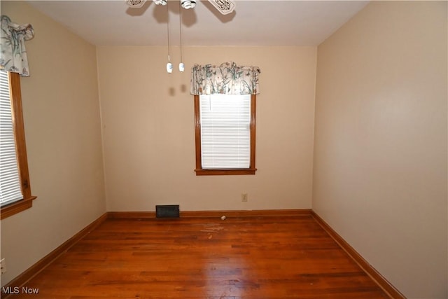 unfurnished room featuring ceiling fan and hardwood / wood-style floors