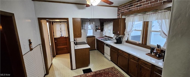 kitchen with white appliances, crown molding, ceiling fan, dark brown cabinets, and brick wall