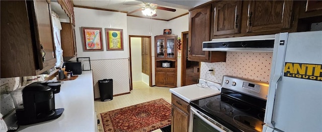 kitchen with stainless steel electric range, ventilation hood, white refrigerator, ceiling fan, and dark brown cabinets