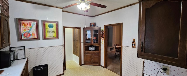 hall with light colored carpet and crown molding