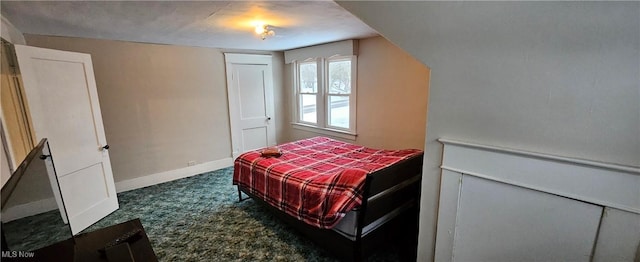 bedroom with dark carpet