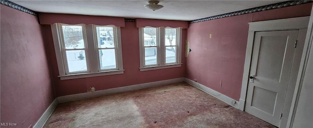 unfurnished room with light carpet