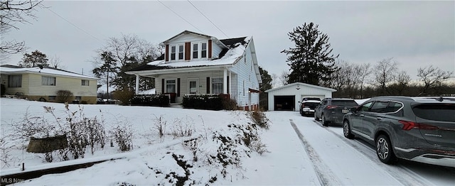 view of front facade with a porch, a garage, and an outdoor structure