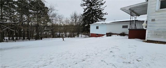 view of yard covered in snow