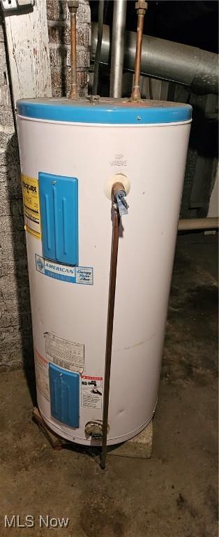 utility room featuring water heater