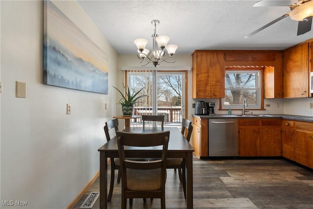 kitchen with dishwasher, a textured ceiling, ceiling fan with notable chandelier, and sink