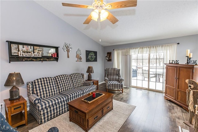 living room featuring hardwood / wood-style floors, vaulted ceiling, and ceiling fan