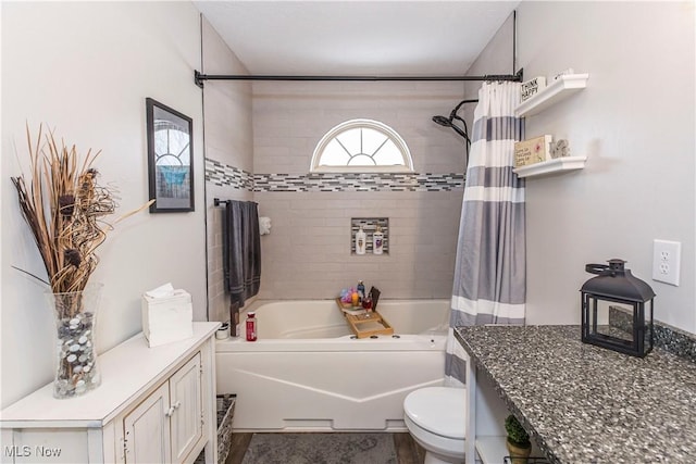 full bathroom featuring vanity, toilet, and shower / bath combo with shower curtain