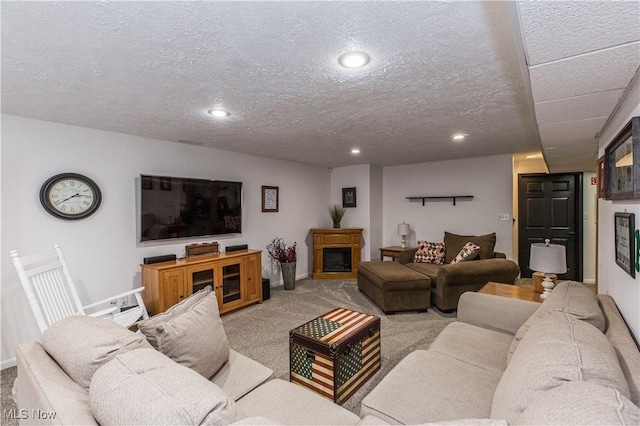 living room with a textured ceiling and light colored carpet