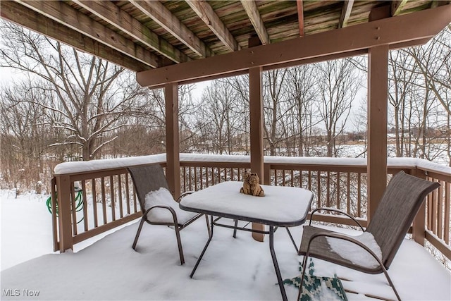 view of snow covered deck