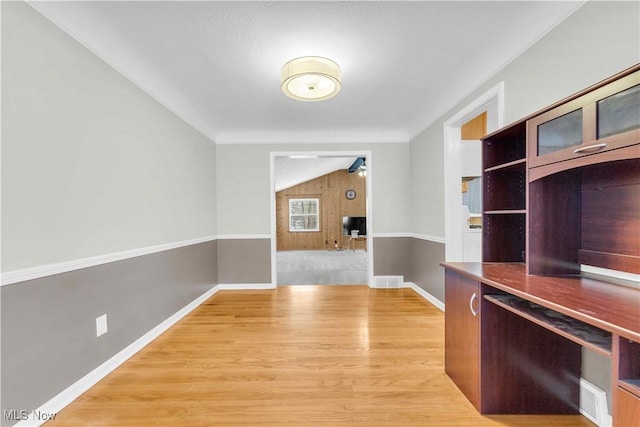 unfurnished office featuring wood-type flooring and ceiling fan