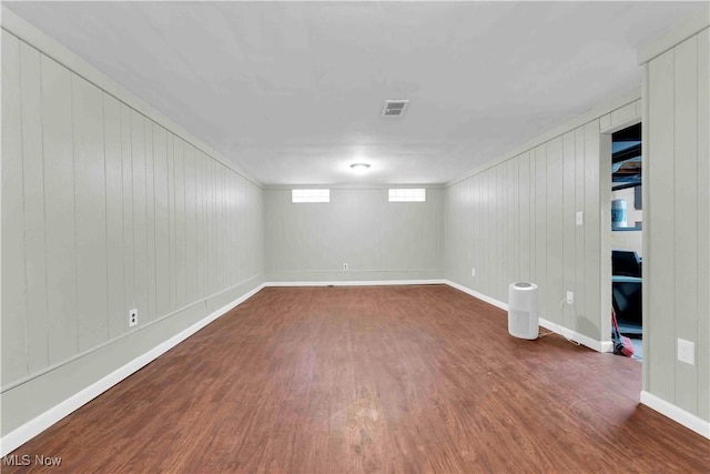 basement featuring dark wood-type flooring