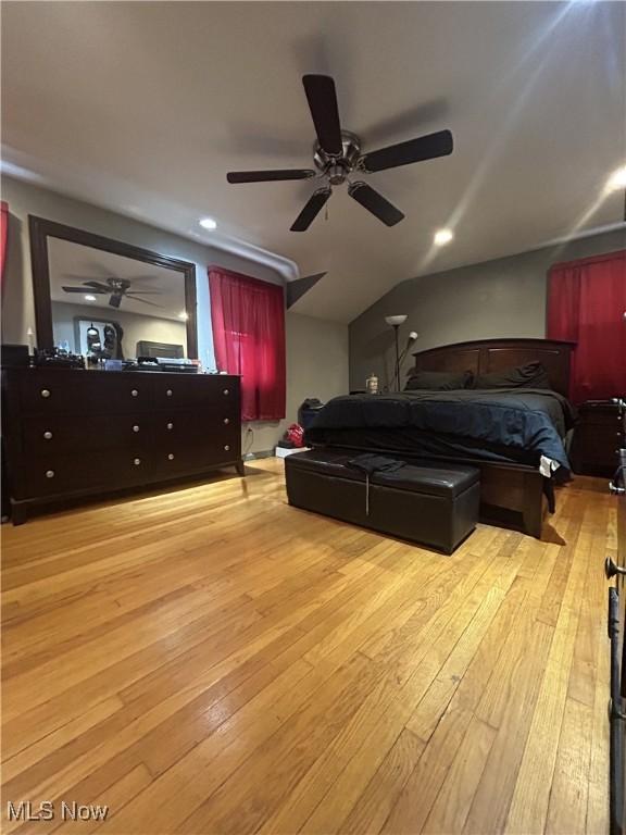 bedroom with ceiling fan and light hardwood / wood-style floors