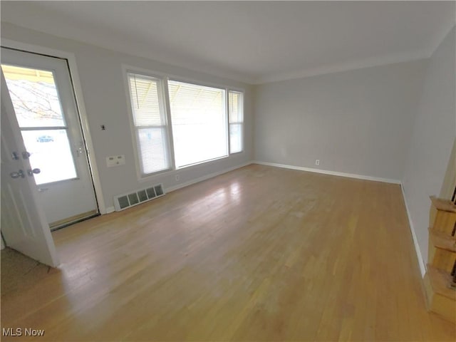 unfurnished living room with light wood-type flooring