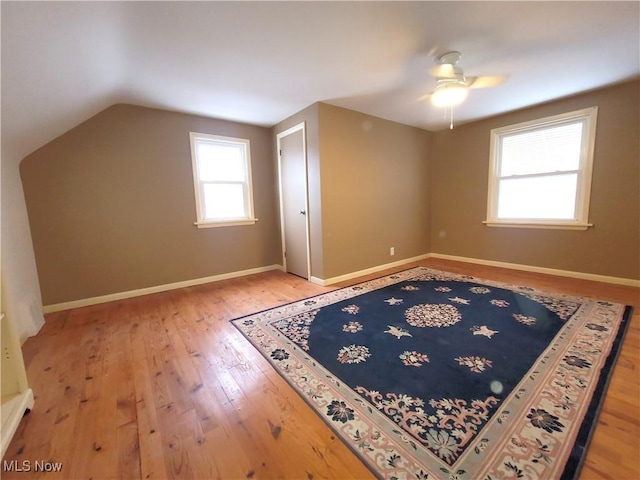 bonus room with hardwood / wood-style flooring, vaulted ceiling, and ceiling fan