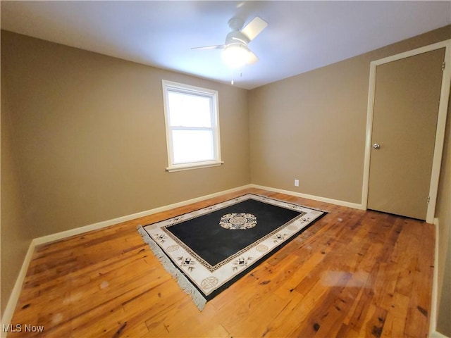 spare room featuring ceiling fan and wood-type flooring