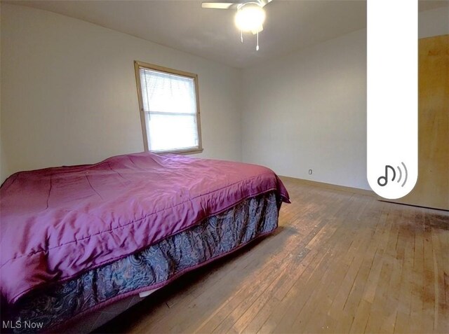 bedroom featuring wood-type flooring and ceiling fan