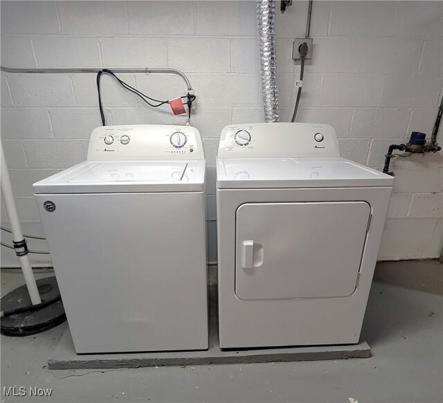 washroom with independent washer and dryer