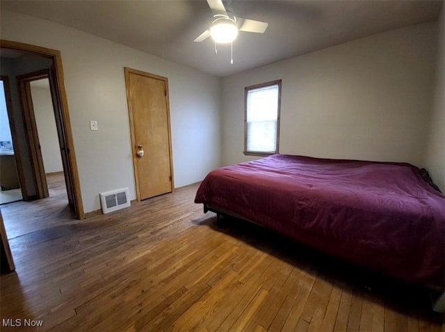 bedroom featuring hardwood / wood-style floors and ceiling fan