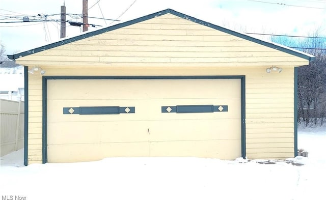 view of snow covered garage