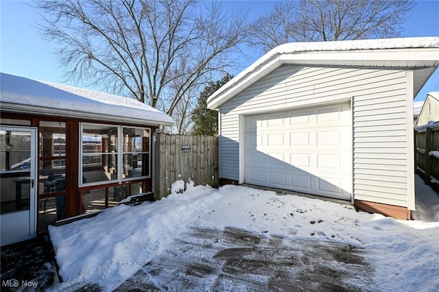 view of snow covered garage