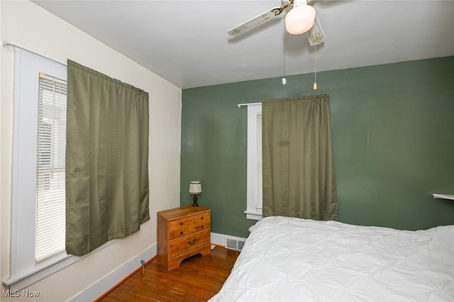 bedroom with wood-type flooring and ceiling fan