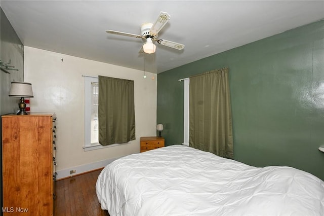 bedroom with hardwood / wood-style flooring and ceiling fan