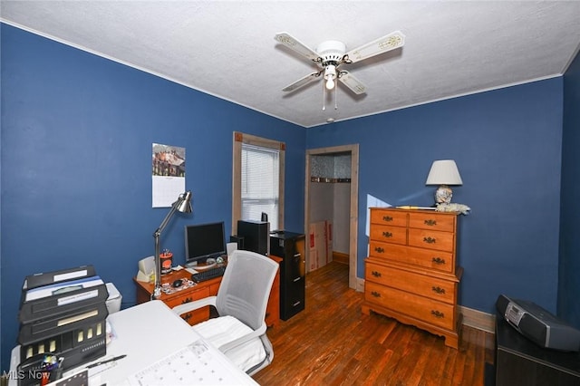 office featuring a textured ceiling, ceiling fan, and dark wood-type flooring