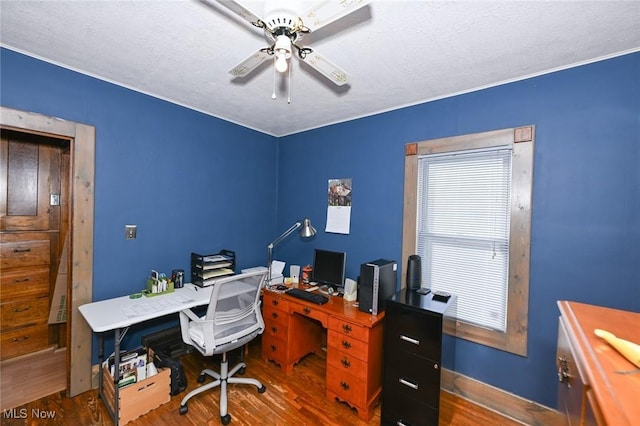 home office featuring ceiling fan, hardwood / wood-style floors, and a textured ceiling