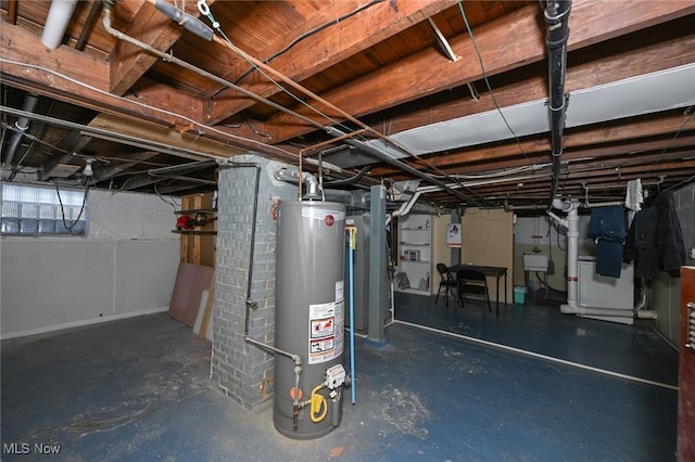 basement with gas water heater and sink