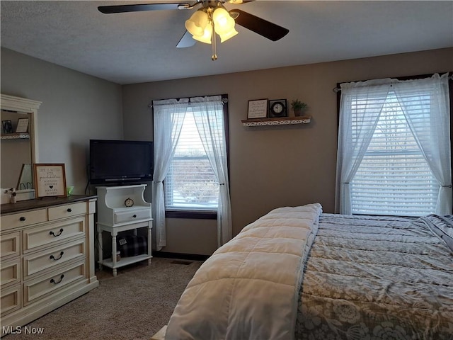 bedroom with carpet flooring and ceiling fan