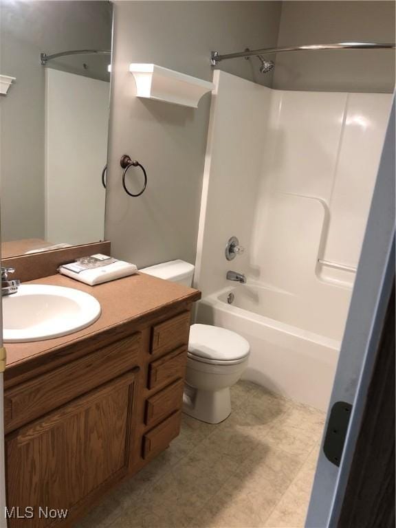 full bathroom with vanity,  shower combination, and toilet