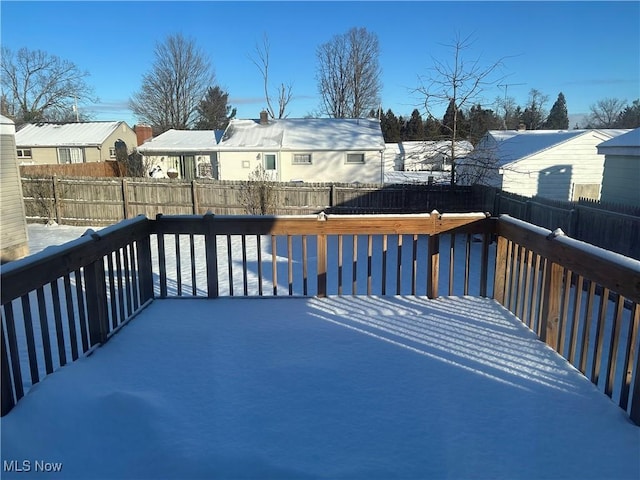 view of snow covered deck