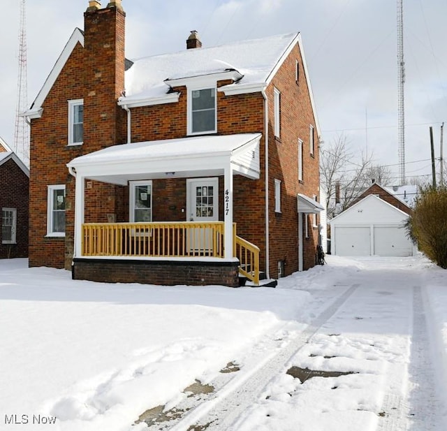 view of front property with an outbuilding and a garage