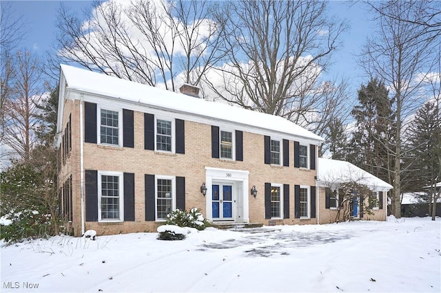 colonial-style house with french doors