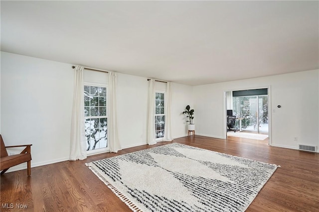 interior space with dark hardwood / wood-style floors