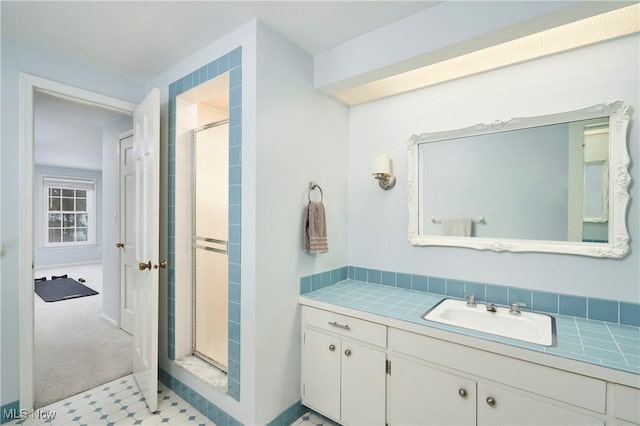 bathroom with vanity and walk in shower