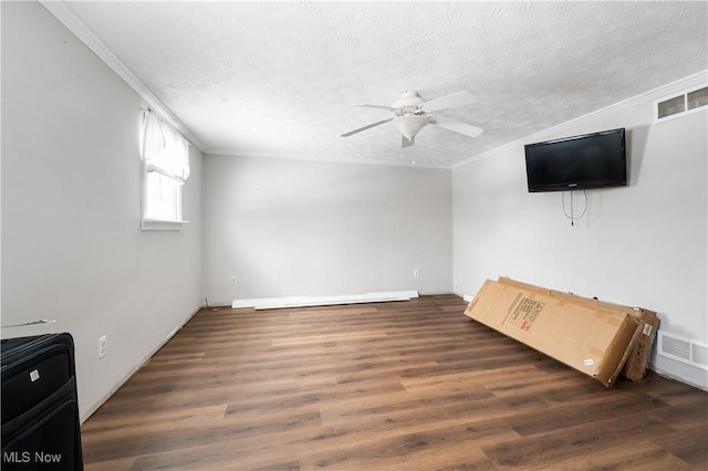 unfurnished living room featuring ceiling fan, ornamental molding, a textured ceiling, and dark wood-type flooring