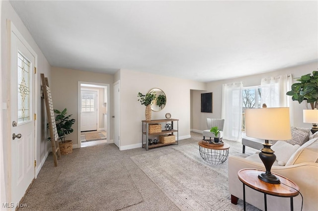 living room with plenty of natural light and carpet