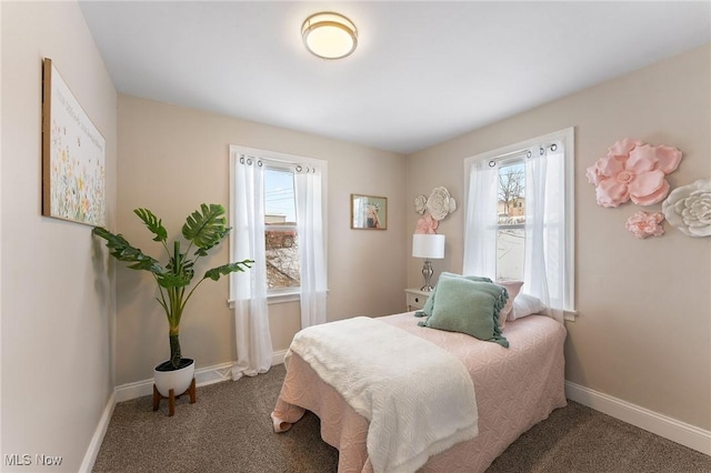 bedroom featuring dark colored carpet