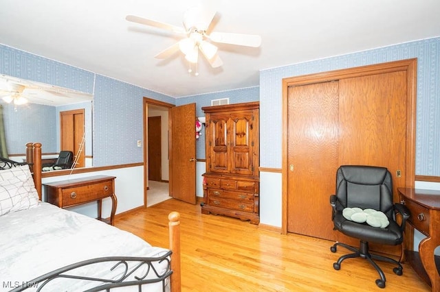 bedroom featuring ceiling fan and light hardwood / wood-style flooring