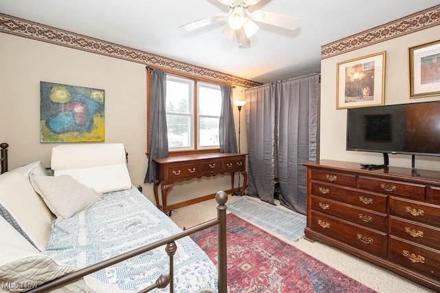 bedroom featuring ceiling fan and carpet floors