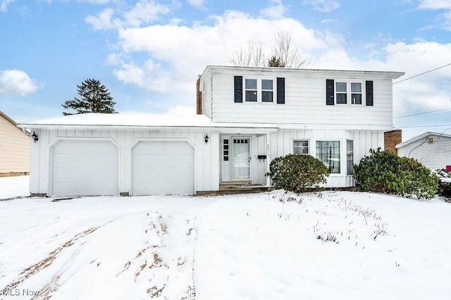 front of property with a garage