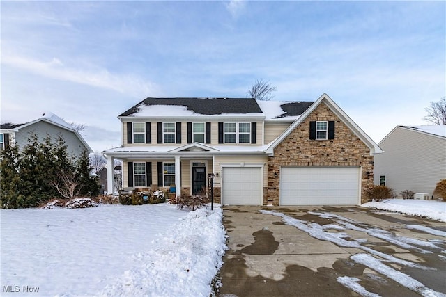 view of front of home with covered porch and a garage