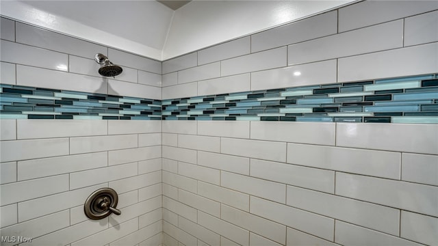 bathroom with a tile shower