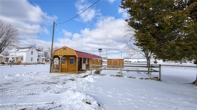 view of front of house with an outbuilding