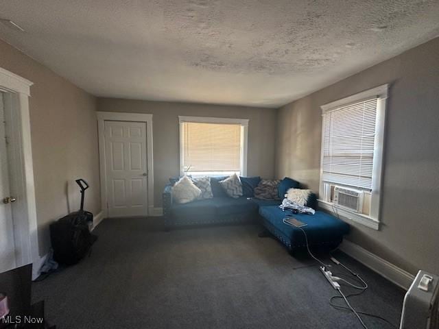 sitting room featuring a textured ceiling and cooling unit