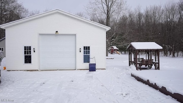 view of snow covered garage